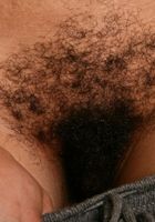 Issabella shows off her ebony body and generous body hair., Issabella (iss002) ATK Exotics: Issabella (Issabella shows off her ebony body and generous body hair.)